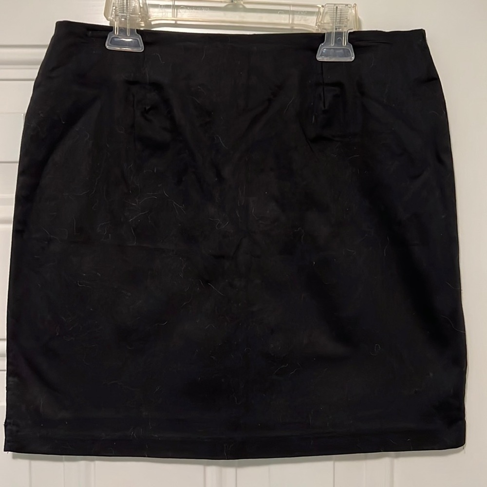 Black Skirt, mini, not too short - 17” long. Size 6. Zips in back.